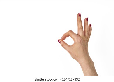 Womans hand ok sign on white background. - Shutterstock ID 1647167332