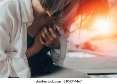 Woman's hand on chest with red spot as suffering on chest pain. Female suffer from heart attack,Lung Problems,Myocarditis, heart burn,Pneumonia or lung abscess, pulmonary embolism day - Shutterstock ID 2104344467