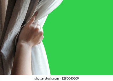 Woman's hand opening curtains in the bedroom with green screen background - Shutterstock ID 1290040309