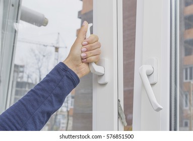 Woman's Hand Opening A Window