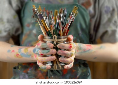 Woman's Hand With Paint Brush.