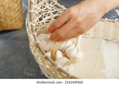 Woman's Hand Picking Vegetables In Basket