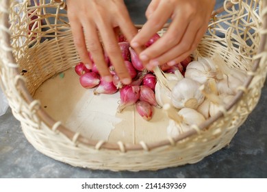 Woman's Hand Picking Vegetables In Basket