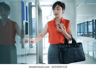 Woman's hand presses the elevator button