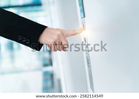 Woman's hand presses the elevator button