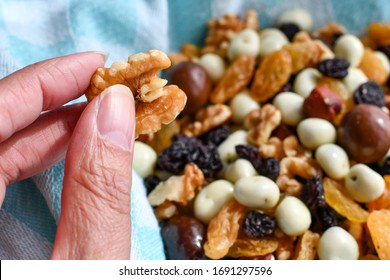 Woman's Hand Reaching For Trail Mix