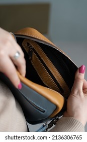 Woman's Hand Shows An Open Bag Inside. Fanny Pack Leather Belt Bag Crossbody Waist Purse  Bag In Soft Leather.