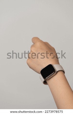Woman's hand with smartwatch and copy space