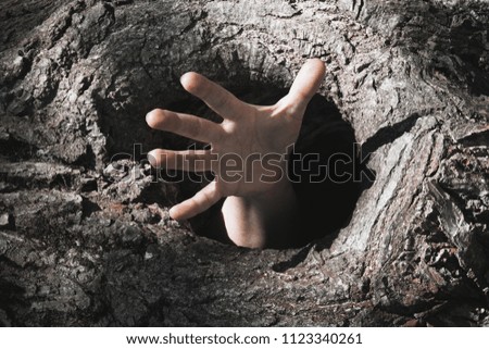 Similar – Image, Stock Photo Child hand reaches through a hole in a concrete wall