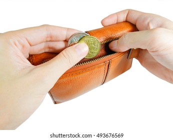 Woman's hand taking australian coins from wallet isolated on white background (with clipping path)