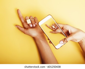 Womans Hand Taking Picture Of Her New Manicure With Fashion Jewellery On Her Phone, Girls Stuff Concept