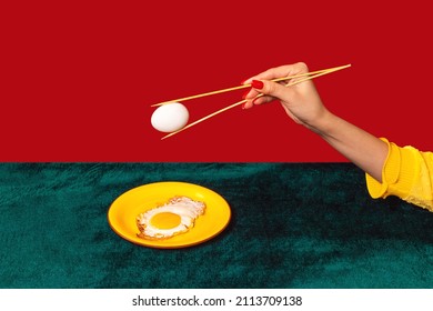 Woman's Hand Tasting Fried Eggs With Chopsticks Isolated On Green And Red Background. Vintage, Retro Style Interior. Food Pop Art Photography. Complementary Colors, Copy Space For Ad, Text