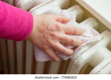 The Woman's Hand Uses A Cloth To Wipe Dust