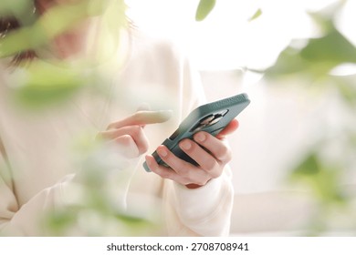 Woman's hand using a smartphone