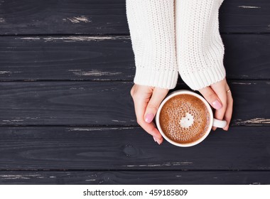 Woman's Hands Holding Cup With Coffee, Top View