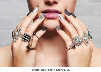 woman's hands with jewelry rings.close-up beauty and fashion portrait. girl make-up and manicure