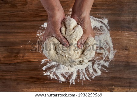 Similar – Image, Stock Photo Anonymous chef preparing pizza in a pizzeria