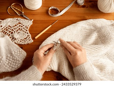 Woman's hands knitting wool yarn pattern. Close up picture. - Powered by Shutterstock