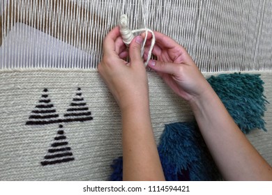 Woman's Hands Making Tapestry