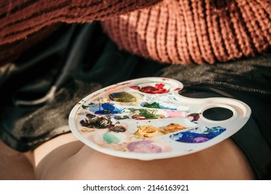 A Woman's Hands Mixing Paints On A Palette Board. Preparing To Paint A Picture. Artistic Tools. The Creative Process.