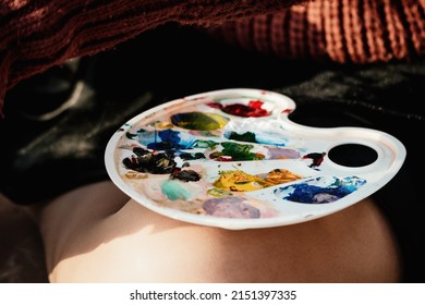 A Woman's Hands Mixing Paints On A Palette Board. Preparing To Paint A Picture. Artistic Tools. The Creative Process.