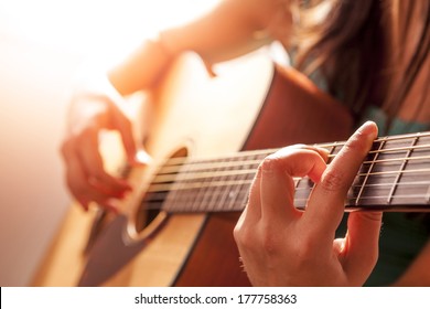 Woman's Hands Playing Acoustic Guitar, Close Up