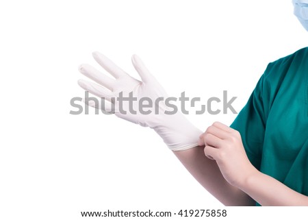Woman's hands putting on surgical gloves-isolation over white background
