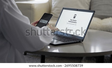 Woman's hands setting up two-factor authentication