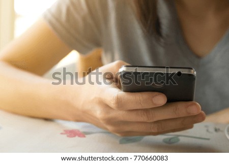 Woman's Hands using a smart-phone, Shopping online concept.