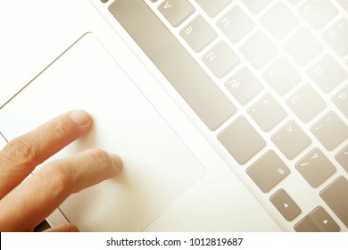 Woman's hands working using a laptop and feeling relaxed.
