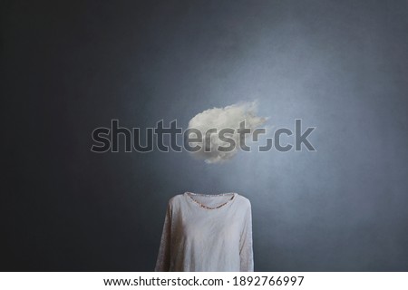 woman's head replaced by a white cloud