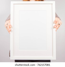 Woman's Holding A Blank Picture Frame