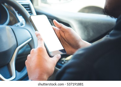 woman's holding empty screen of smart-phone inside a car - Shutterstock ID 537191881