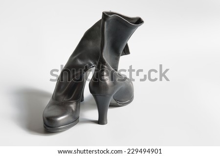 Woman's leather boots on white background