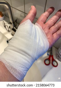 Woman's Left Hand With A Bandage After An Injury