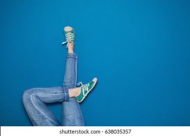 Woman's Legs Up Against A Wall In A Relaxed Pose