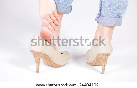Woman's legs ankle pain in high heels