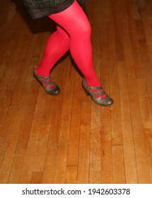 Woman's Legs On Wooden Dance Floor