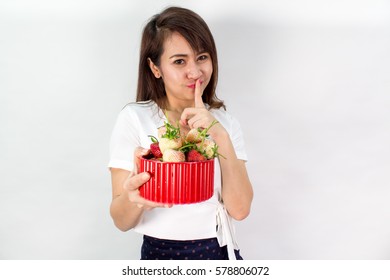 Woman's Making Chu Sign And Holding A Bowl Of Strawberries Isolated On White Background