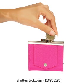 A Woman's Manicured Hand Dropping A Coin Into A Pink Purse Isolated On White.