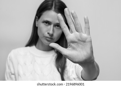 Woman's palm close up, gesture stop and don't move, stop domestic violence - Shutterstock ID 2196896001
