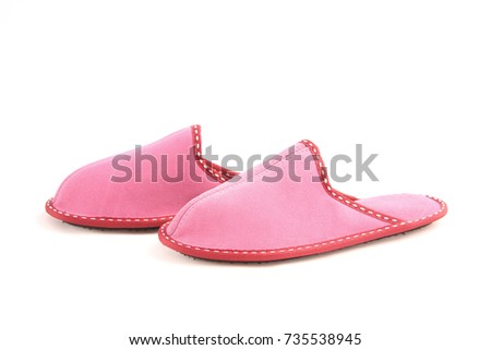 Woman's pink leather slippers isolated on white background