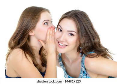 woman's secret, two young beautiful women friends whisper funny news - Powered by Shutterstock