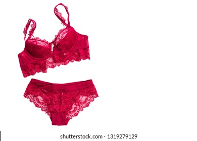 Woman's sexual red lingerie isolated on white background. Copy space for your text.  Women's lacy underwear pants and brassiere. Top view, flat lay