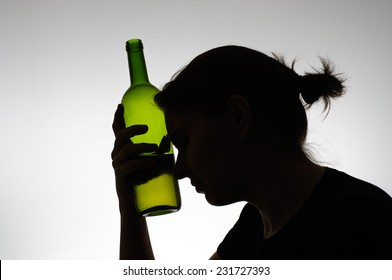 Woman's silhouette with a wine bottle
