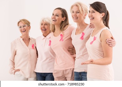 Women Of All Ages United With The Pink Ribbon Of Breast Cancer Awareness