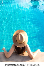 Women all inclusive relaxing near luxury swimming pool.  Summer Concept.