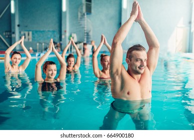 Women aqua aerobics class in water sport center