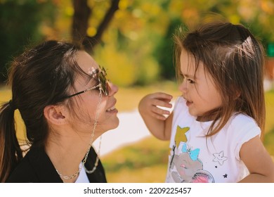 Women And Baby Girl. Mother And Daughter Autumn Photo Shoot. October Park. Family Photo Shoot.