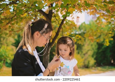 Women And Baby Girl. Mother And Daughter Autumn Photo Shoot. October Park. Family Photo Shoot.